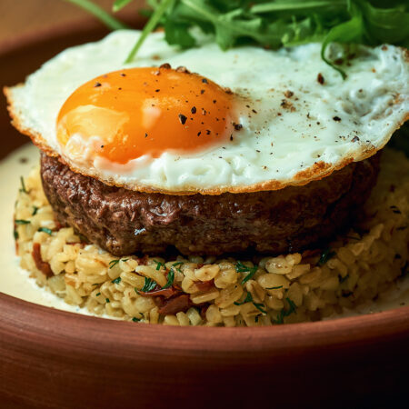 Loco Moco ground burger patty with brown rice and fried egg brown gravy - gluten free