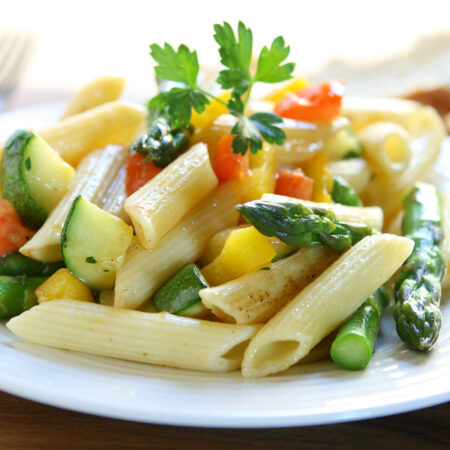 Pasta primavera with fresh veggies, olive oil, garlic lemon and feta cheese